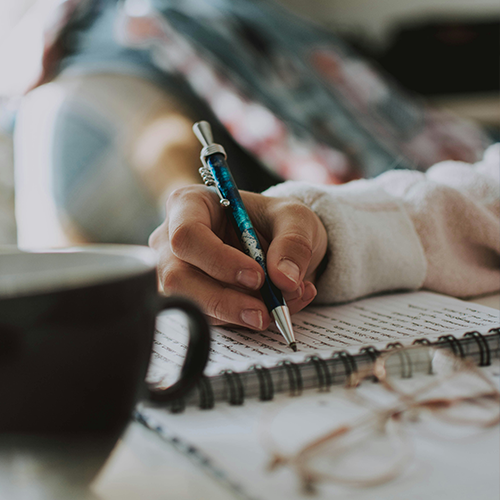 writing a letter in a notebook