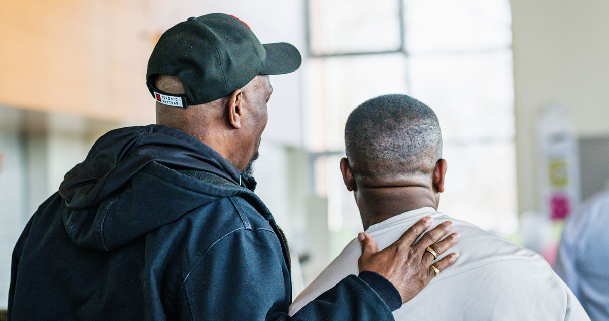 comforting hand on shoulder